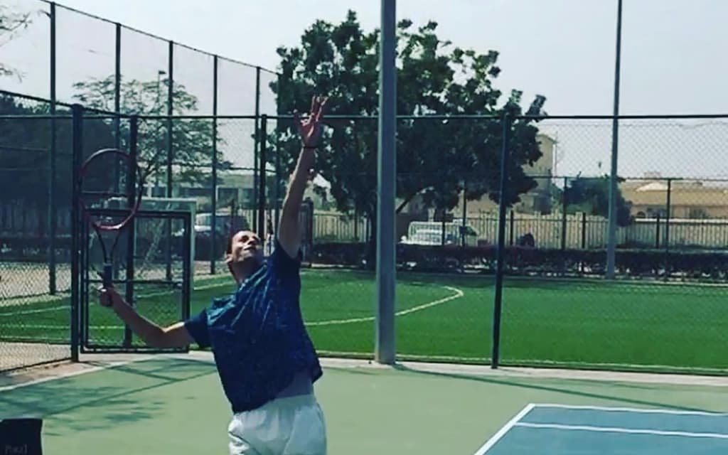 A player serving during a session in Dubai